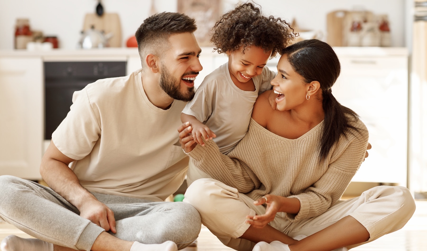 a family on a kitchen floor
